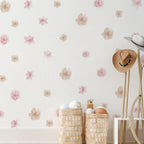 Floral wallpaper with decorative baskets and a hat against a light background