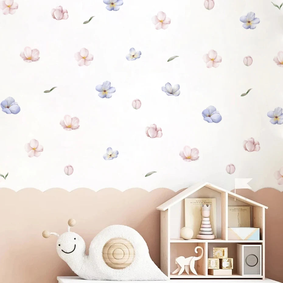 Children's room with a toy house, plush snail, and floral wall decals.