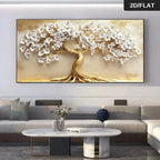 Decorative wall art of a tree with white flowers on a beige background in a living room setting.