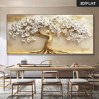 Decorative wall art of a tree with white flowers and gold trunk in a modern living room.