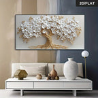Decorative wall art of a tree with white flowers and gold branches in a living room setting.