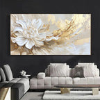 Abstract floral painting in a living room with a gray sofa and coffee table.