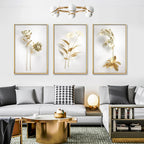 Modern living room with a gray sofa, gold coffee table, and floral wall art.