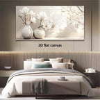 A large rectangular wall art canvas showing white flowers in two vases against a soft light background, displayed above a neatly made bed in a modern bedroom. The text '2D flat canvas' appears below the artwork.