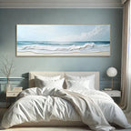 Bedroom with a large framed beach scene painting on the wall.
