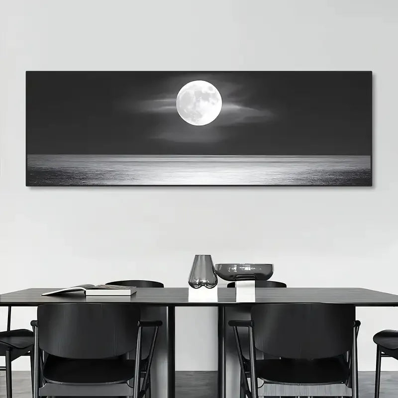 Panoramic wall art of a moonlit sky over water in a modern dining room.
