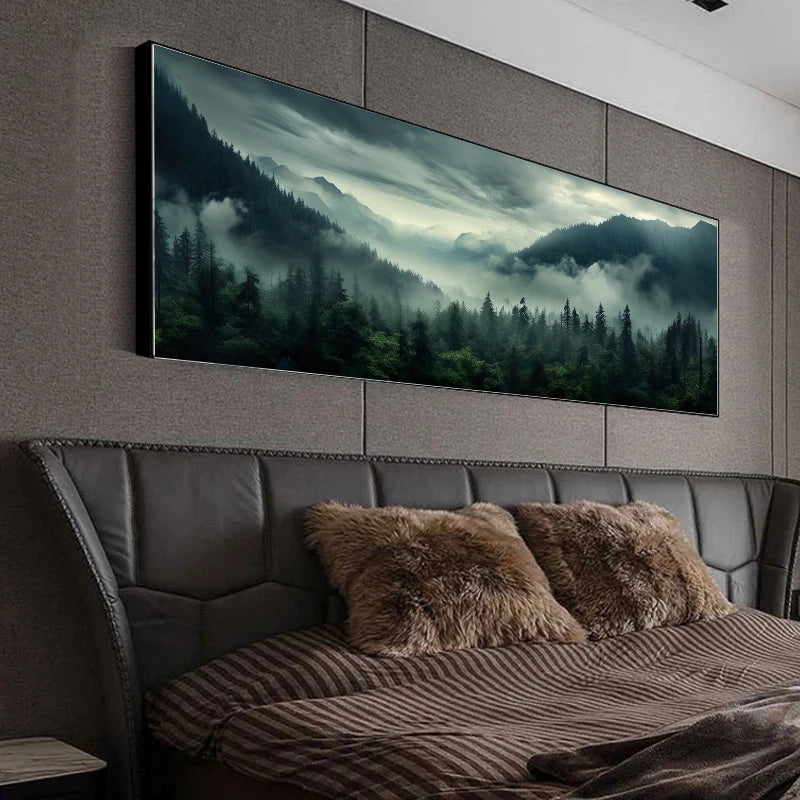 Large wall art of a forest scene above a bed with brown pillows.