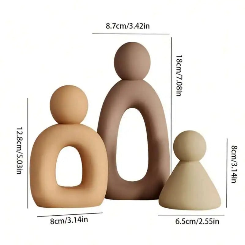 Three brown ceramic figures with measurements on a white background